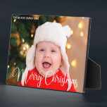Merry Christmas Script Overlay Chic Baby Photo Plaque<br><div class="desc">Elegant Merry Christmas photo plaque with beautiful cursive script in white. This modern holiday baby photograph gift features gorgeous typography and your custom text over the full bleed picture in white at the top. Perfect to celebrate a smiling baby or happy child.</div>