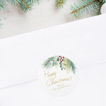 Merry Christmas Watercolor Greenery Classic Round Sticker<br><div class="desc">This festive sticker is decorated with red,  green,  and gold watercolor foliage and says Merry Christmas in script typography. 
Easily customisable. 
Original Watercolor © Michele Davies.</div>