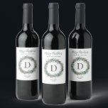 Merry Christmas Winter Greenery Monogram Wreath Wine Label<br><div class="desc">Elegant "Merry Christmas" holiday homemade wine label design features a rustic chic round wreath of winter watercolor greenery framing the family's last name monogram initial letter. Personalise the modern green and charcoal grey wording with a custom greeting, last name, the type of wine, and the year. Clean white background colour...</div>