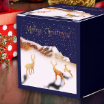 Merry Christmas - wood deers and mountains in snow Favour Box<br><div class="desc">Celebrate the season with this enchanting gift box adorned with my Fantabuloustef artwork. Featuring three wooden deer in a snowy Christmas night scene, nestled near a wooden mountain, it's a true winter wonderland. "Merry Christmas" is elegantly written in shimmering golden calligraphy, adding a touch of festive magic. Perfect for bringing...</div>