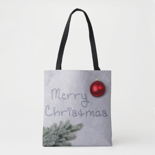 Merry Christmas written in the Snow Tote Bag (Front)