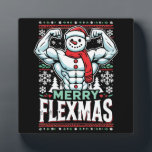 Merry Flexmas - Snowman Flexing Christmas Gym  Plaque<br><div class="desc">Embrace the festive spirit and gym grind with this hilarious "Merry Flexmas" design! Showcasing a ripped snowman with bulging biceps, surrounded by festive elements like snowflakes, Christmas trees, and holiday patterns, this design is perfect for anyone who refuses to skip their workout, even during the holiday season. Whether you're a...</div>