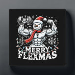 Merry Flexmas - Snowman Flexing Christmas Gym  Plaque<br><div class="desc">Embrace the festive spirit and gym grind with this hilarious "Merry Flexmas" design! Showcasing a ripped snowman with bulging biceps, surrounded by festive elements like snowflakes, Christmas trees, and holiday patterns, this design is perfect for anyone who refuses to skip their workout, even during the holiday season. Whether you're a...</div>