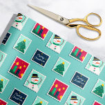 Merry Mail Teal Holiday Postage Stamps Pattern Wrapping Paper<br><div class="desc">This festive holiday gift wrapping paper features a pattern of merry illustrated postage stamps,  including a cute winter snowman,  a smiling Christmas tree,  bright lit candles,  and "Merry Christmas" modern script text with a starry night sky. The light teal green blue background color can be customized.</div>