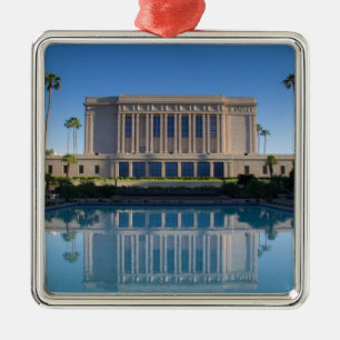 Mesa temple reflecting in a blue pool metal tree decoration