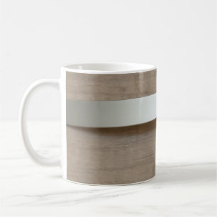 Metal curved plate with wooden surface behind it coffee mug