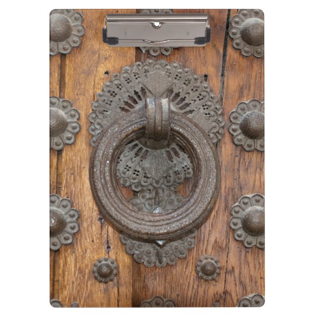 Metal Knocker on Old Wooden Door Clipboard (Front)