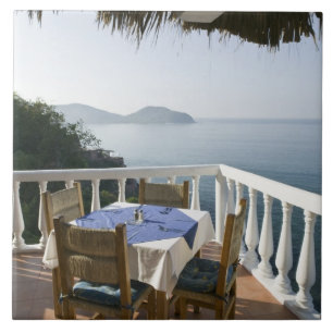 Mexico, Guerrero, Zihuatanejo. Cafe Table over Tile
