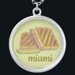 Miami Florida Ham Swiss Cheese Cuban Sandwich Silver Plated Necklace<br><div class="desc">Illustration features a delicious Cuban sandwich--a Miami, Florida favourite! This tasty pressed sandwich, a version of a classic ham and cheese, has Cuban bread, ham, Swiss cheese, pickles, mustard, and sometimes salami. Great for your favourite Floridian! This Cuban sandwich foodie design is also available on other products. Lots of other...</div>