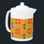 Mid Century Modern Orange Pattern Teapot<br><div class="desc">Knock, knock. Who's there? Mid Century Modern Orange Pattern Teapot! Hey, with a design this retro, you don't need a punch line. This perfectly mod pattern features a vibrant orange background and rows of an adorably kitschy shape in green, red, turquoise, black & white, and wood grain. The shape probably...</div>