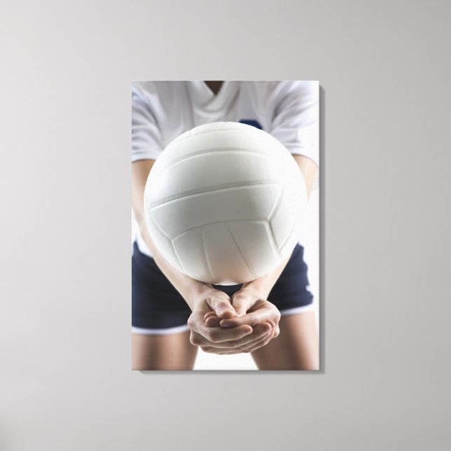 Mid section view of a young woman serving a canvas print (Front)