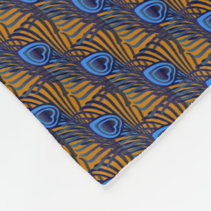 Midnight blue and orange peacock feather pattern fleece blanket
