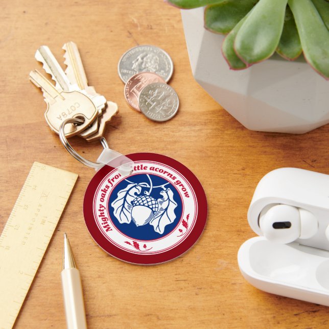 Mighty oaks from little acorns grow on deep red key ring (Desk)