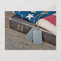 Military Dog Tags on Bible with flag