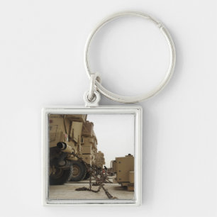 Military vehicles are locked down on semi truck key ring