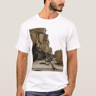 Military vehicles are locked down on semi truck T-Shirt