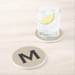 Minimal Black Beige Monogram Initial Stone Coaster<br><div class="desc">Minimal monogram initial design features a simple beige background with your initial in classic block typography in white for a clean,  simple stylish look.</div>