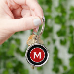 Minimal Classic Monogram Black Red Key Ring<br><div class="desc">Minimal monogrammed round keychain features a black background with your monogram initial in red emblem in white classic block typography for a simple classic professional look.</div>