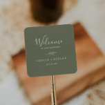 Minimal Leaf | Dark Green Wedding Welcome Square Sticker<br><div class="desc">These minimal leaf dark green wedding welcome stickers are perfect for a boho wedding. The design features a simple greenery leaf silhouette in olive green with minimalist mountain bohemian style. Personalise these stickers with the location of your wedding, names, and wedding date. These labels are perfect for destination weddings and...</div>