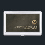 Minimal Luxury Black Gold Monogram Business Card Holder<br><div class="desc">Minimalist monogram design with brushed metallic gold monogram medallion with personalised name and title or custom text below in classic block typography on a textured background in shades of black chestnut brown. Personalise for your custom use.</div>