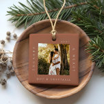 Minimal Modern Engaged & Merry 2 Photo Engagement Ceramic Ornament<br><div class="desc">Minimal and modern simple photo keepsake photo ornament to commemorate your first Christmas engaged. The design features a simple minimal design with a square photo design to display your special engagement photo. "Engaged & Merry", year and couple's name displayed in a simple modern design around the photo. Two photo ornament...</div>