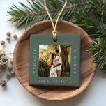 Minimal Modern Engaged & Merry 2 Photo Engagement Ceramic Ornament<br><div class="desc">Minimal and modern simple photo keepsake photo ornament to commemorate your first Christmas engaged. The design features a simple minimal design with a square photo design to display your special engagement photo. "Engaged & Merry", year and couple's name displayed in a simple modern design around the photo. Two photo ornament...</div>