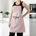 Minimal Pink Modern Typographic Monogram Apron<br><div class="desc">Enhance your cooking experience with the Minimal Pink Modern Typographic Monogram Apron. This sleek apron features a soft blush pink colour and a contemporary typographic monogram, offering a personalised touch to your kitchen attire. Made from high-quality, durable fabric, it provides excellent coverage and protection while cooking or baking. The adjustable...</div>