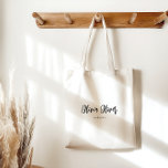 Minimal Script Calligraphy Ivory Cream Chic Modern Tote Bag<br><div class="desc">Elevate your everyday carry with our Minimalist Black and Ivory Cream Script Tote Bag. The chic design offers ample clean space for handwritten notes or personal touches, while the elegant script calligraphy adds a sophisticated flair. This tote is the perfect blend of style and functionality, making it a must-have for...</div>