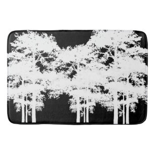 Minimalist black and white tree silhouettes    bath mat