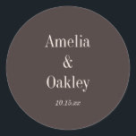 Minimalist Earthy Brown Elegant Wedding Custom Classic Round Sticker<br><div class="desc">This elegant round wedding sticker features a deep earthy brown background with couple names in large, classic cream serif type and a customizable date in delicate italic script below. Minimal, modern, and quietly sophisticated — pairs beautifully with fall and neutral-palette weddings for envelope seals, favor bags, or wedding decor. Simply...</div>