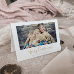 Minimalist Gold Merry Christmas Landscape Photo Holiday Card<br><div class="desc">This minimalist gold Merry Christmas landscape photo holiday card is the perfect simple holiday greeting. The design features classic gold and white typography paired with a rustic yet elegant script font with hand lettered style. Add your family picture and personalise the card with your family name, year, inside greeting, and...</div>