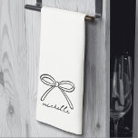 Minimalist Hand Drawn Bow Name Tea Towel<br><div class="desc">Simple Name Monogram Minimalist Kitchen Towel. Add a stylish and functional touch to your kitchen with this adorable tri-fold towel, perfect for everyday use or special occasions. The design features a single hand-drawn bow centred at the bottom when folded, with a personalised name in sweet handwritten script calligraphy beneath it....</div>