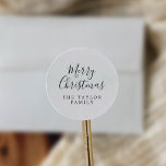 Minimalist Merry Christmas Holiday Gift Classic Round Sticker<br><div class="desc">These minimalist Merry Christmas holiday gift stickers are perfect for a simple holiday present or holiday card. The design features classic black and white typography paired with a rustic yet elegant script font with hand lettered style. Personalise the stickers with your name.</div>