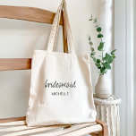 Minimalist Modern Script Bridesmaid Wedding Tote Bag<br><div class="desc">Celebrate your bridal party with our Modern Minimalist Script Bridesmaid Gift Tote Bags for Bachelorette Party. This typography design masterpiece gracefully blends an elegant script font with a timeless, understated san serif font. Ideal for bachelorette parties, bridal shower or wedding proposals, this tote bag can be personalised with their names,...</div>