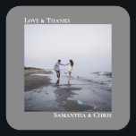 Minimalist Photo Grey Love & Thanks Wedding Square Sticker<br><div class="desc">These stickers are perfect for wedding thank you gifts or favours, or as an addition to your invitation mailing. They feature a simple minimalist design with your square photo on a grey or grey background. The left justified caption atop the photo reads "Love and Thanks", while the couple's names below...</div>
