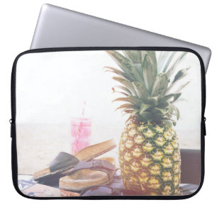 Minimalist photography of pineapple near sandals a laptop sleeve