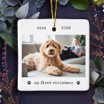 Minimalist Typewriter Dog's First Christmas Photo Ceramic Ornament<br><div class="desc">These simple and minimalist Christmas holiday ornaments feature your favorite photo of your dog or puppy on the front along with his name, the year, and the words "my first christmas" in black typewriter look text with two cute paw prints. The back features another photo of your pet, lightened with...</div>