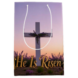 Minimalist white cross adorned with lavender medium gift bag