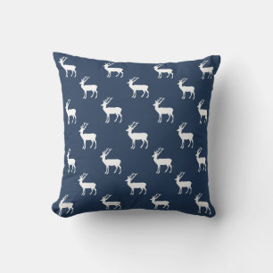 Minimalist white reindeer pattern on blue cushion