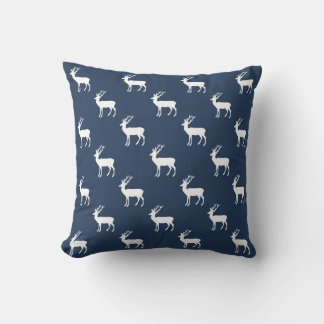 Minimalist white reindeer pattern on blue cushion