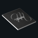 Minimalistic modern monogram initial name notepad<br><div class="desc">Minimalistic modern monogram initial name black white. Personalizable custom name with a cursive initial behind on a black colour.</div>