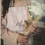 Minimalistic Monogram Initial & Name Pastel Pink Apron<br><div class="desc">Cook and bake in style with our Minimalistic Monogram Initial & Name Pastel Pink Apron. This elegant apron features a sleek design personalised with your initial and name, set against a soft pastel pink background. Made from high-quality, durable fabric, it offers excellent protection and comfort while you prepare your favourite...</div>