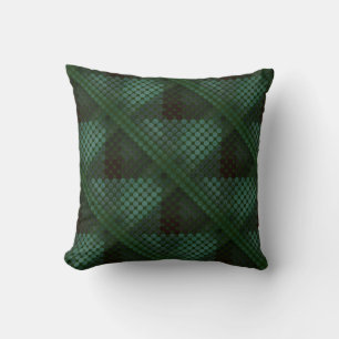 Mint button or pit on forest green, forming shapes cushion