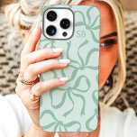 Mint Green Bow Monogram iPhone 16 Pro Max Case<br><div class="desc">Dress up your phone in style with this chic and trendy mint green phone case! Featuring a playful pattern of hand-drawn bows and personalised with your monogram, this case is the perfect blend of fashion and function. Made from durable materials to protect your phone from everyday bumps and scratches. A...</div>