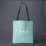 Mint Green Modern Script Personalised Bridesmaids Tote Bag<br><div class="desc">Add a personal touch to your wedding with personalised bridesmaids gift tote bag. This tote bag features personalised bridesmaid's name in white modern script font style and monogram in light green modern script font style as background with title and wedding date in white modern sans serif font style on mint...</div>