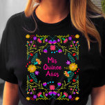 Mis Quince Anos Mexican Fiesta Black Pink Birthday T-Shirt<br><div class="desc">Black Quinceanera T-Shirt, which you can personalise with your name on the back, if you wish. Colourful floral design with Mexican fiesta flowers and bright pink, hand lettered typography. The wording reads "Mis Quince Anos" - perfect as a 15th birthday party gift or for the Quinceanera to wear during all...</div>