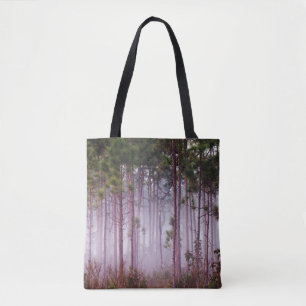 Mist among pine trees at sunrise, Everglades Tote Bag