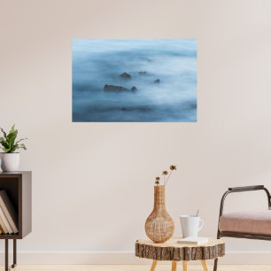 Misty blue long exposure of rocks in sea poster