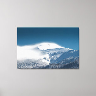 Misty clouds over snowy mountain Snežnik, Slovenia Canvas Print