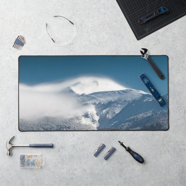 Misty clouds over snowy mountain Snežnik, Slovenia Desk Mat (Workstation)